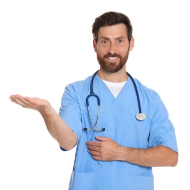 Portrait of doctor in scrubs on white background