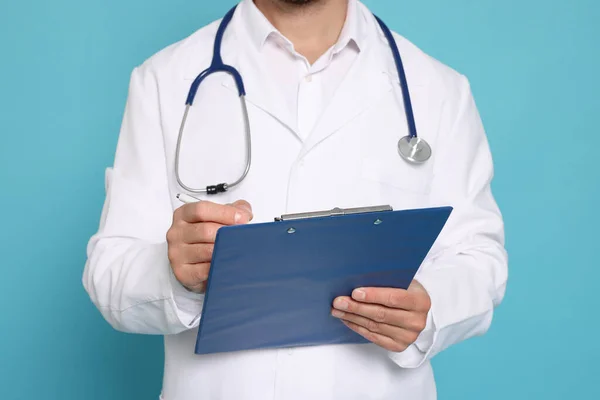 Doctor Stethoscope Clipboard Light Blue Background Closeup — Stock Fotó