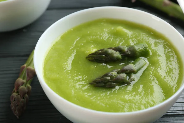 Delicious Asparagus Soup Bowl Grey Wooden Table Closeup — Zdjęcie stockowe