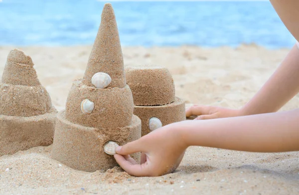 Child Decorating Sand Castle Shell Beach Closeup — Zdjęcie stockowe