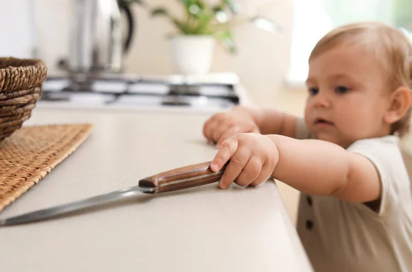 Little Child Touching Sharp Knife Indoors Dangers Kitchen — 스톡 사진