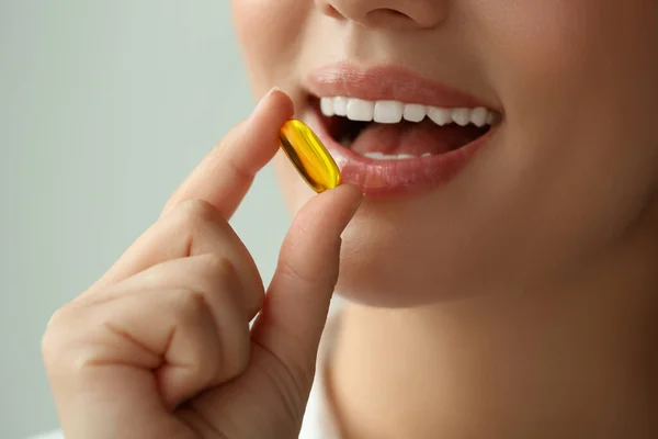 Young Woman Taking Dietary Supplement Pill Blurred Background Closeup — 스톡 사진