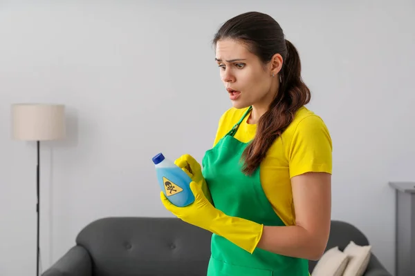Woman Looking Bottle Toxic Household Chemical Warning Sign Indoors — Fotografia de Stock