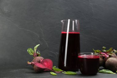 Freshly made beet juice on black table