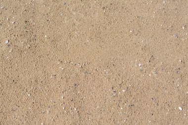 Arka plan olarak kumlu sahil dokusu, üst manzara