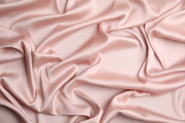 Arka plan olarak narin pembe ipeğin dokusu, üst görünüm