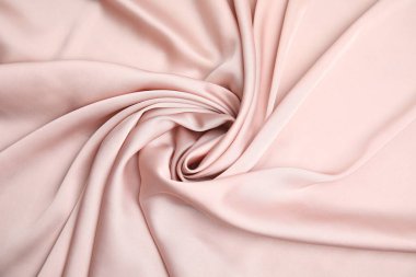 Arka plan olarak narin pembe ipeğin dokusu, üst görünüm
