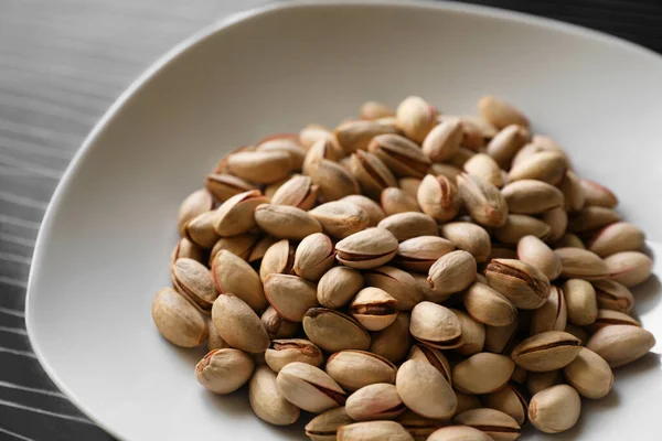 Many Tasty Pistachios Black Table Closeup View — 图库照片