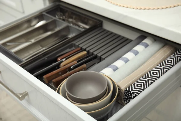 Open Drawer Kitchen Cabinet Different Utensils Dishware Towels Closeup — Foto de Stock
