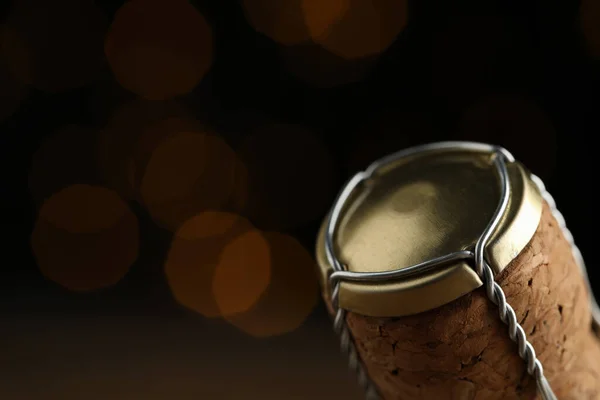 Closeup View Sparkling Wine Cork Muselet Cap Blurred Festive Lights — Stockfoto