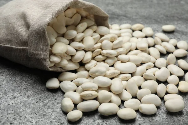 Bag Raw White Beans Grey Table Closeup —  Fotos de Stock