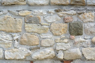 Arka plan olarak eski taş duvarın dokusu, yakın plan