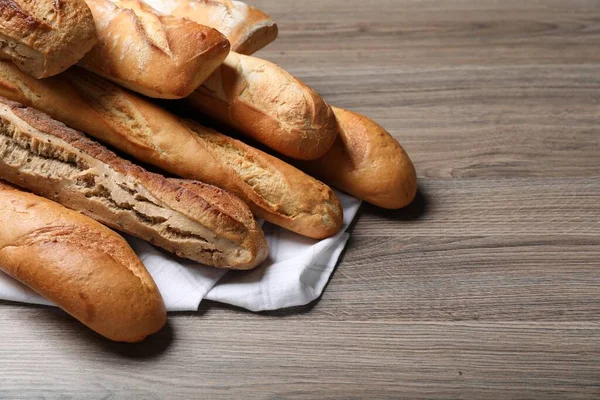 Different Tasty Baguettes Wooden Table Space Text — Stock fotografie