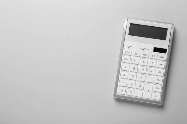 White Calculator Light Background Top View Space Text — стоковое фото