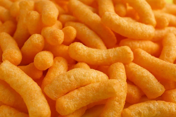 Tasty Cheesy Corn Puffs Background Closeup — Stock Photo, Image