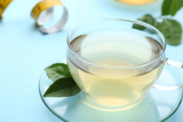 Glass Cup Diet Herbal Tea Green Leaves Light Blue Background — Stockfoto