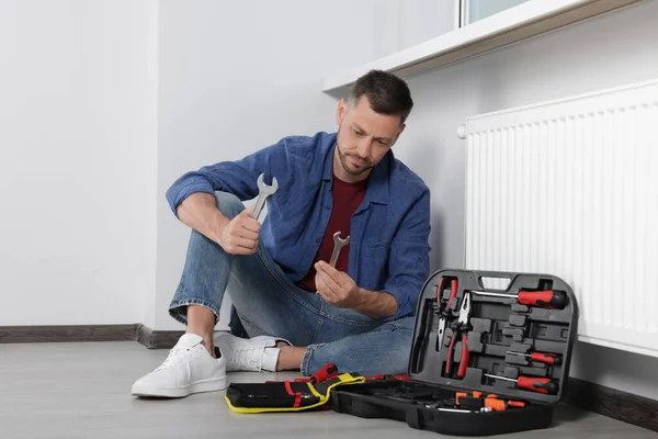 Man Choosing Wrench Box Tools Indoors — Zdjęcie stockowe