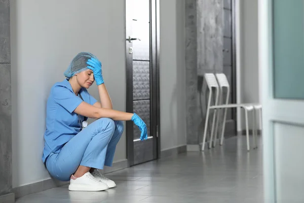 Exhausted Doctor Sitting Floor Hospital Space Text — Foto de Stock