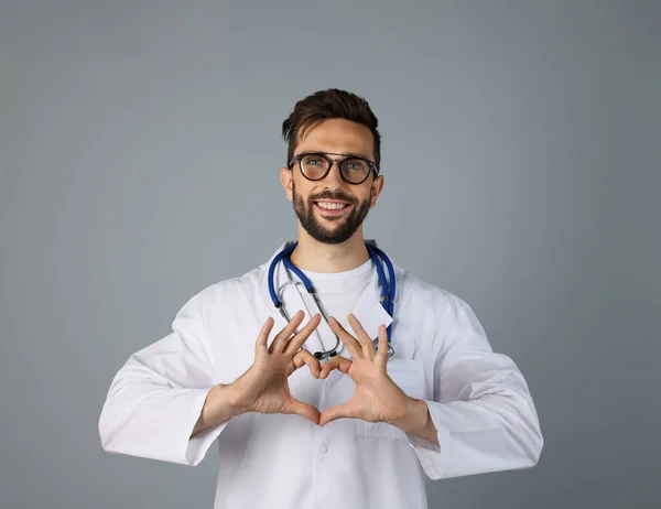 Doctor Making Heart Hands Grey Background — Stock Fotó