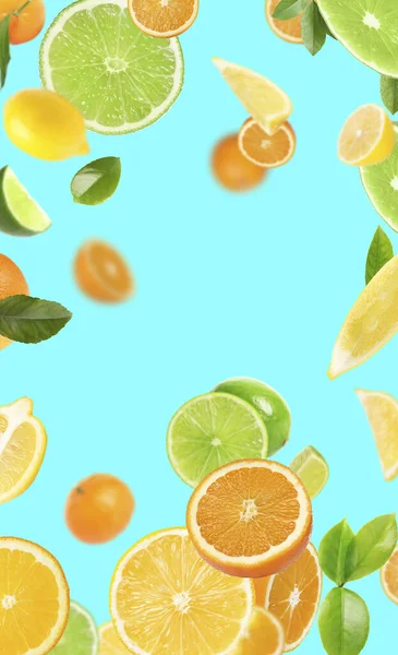 Fresh Juicy Citrus Fruits Green Leaves Falling Cyan Background — Fotografia de Stock