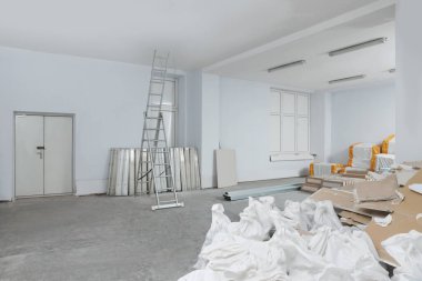 New and used building materials in room prepared for renovation