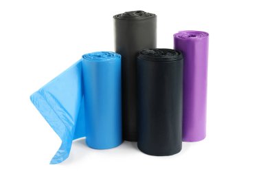 Rolls of different garbage bags on white background. Cleaning supplies
