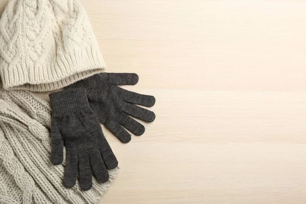 Stylish Gloves Scarf Hat White Wooden Background Flat Lay Space — Zdjęcie stockowe