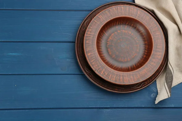 Clay Plates Blue Wooden Table Flat Lay Space Text — ストック写真