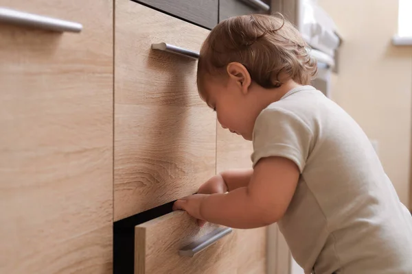 Little Child Exploring Drawer Indoors Dangerous Situation — 스톡 사진