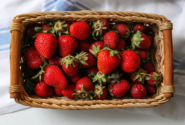 Wicker Basket Ripe Strawberries Napkin White Table Top View — Fotografia de Stock
