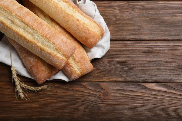 Different Tasty Baguettes Spikelets Wooden Table Flat Lay Space Text — 스톡 사진