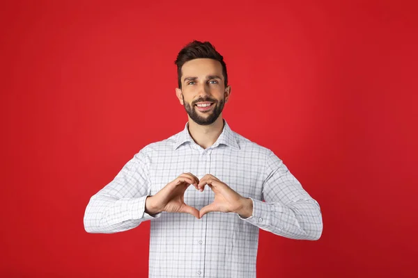 Happy Man Making Heart Hands Red Background — Foto de Stock