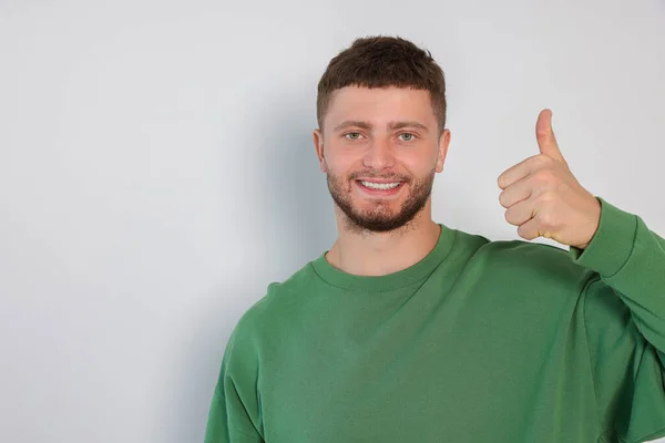 Young Man Showing Thumb White Background Space Text — Stok fotoğraf