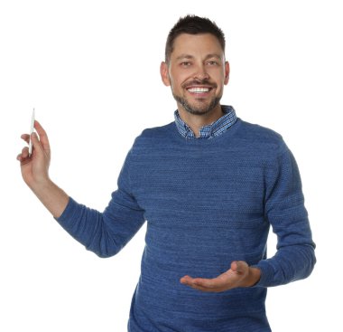 Handsome man pointing at something with pen on white background. Weather forecast reporter
