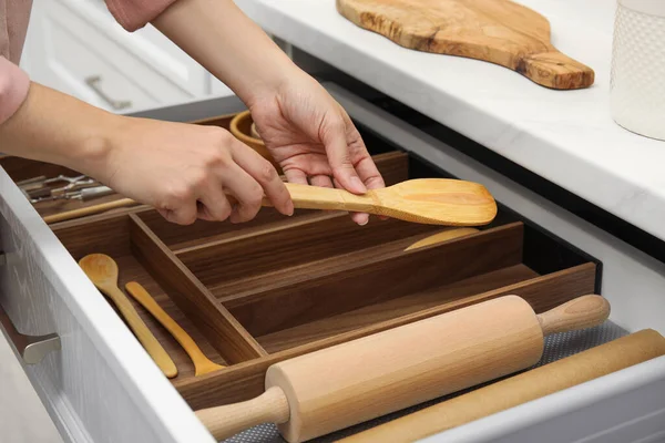 Woman Putting Wooden Spatula Open Drawer Kitchen Cabinet Closeup — Fotografia de Stock