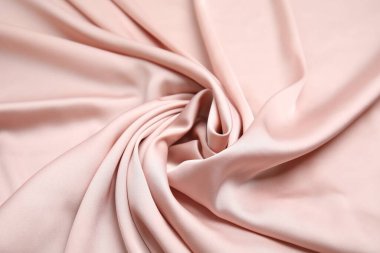Arka plan olarak narin pembe ipeğin dokusu, üst görünüm