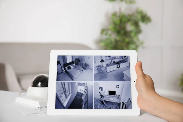Woman Monitoring Cctv Camera Tablet Table Indoors Closeup Home Security — Stockfoto