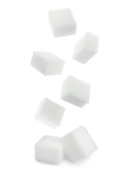 Flying cubes of sugar on white background