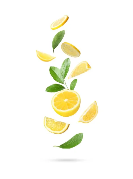 Fresh Ripe Lemons Green Leaves Falling White Background —  Fotos de Stock