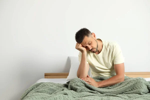 Sleep Deprived Man Sitting Bed Home Space Text — Fotografia de Stock