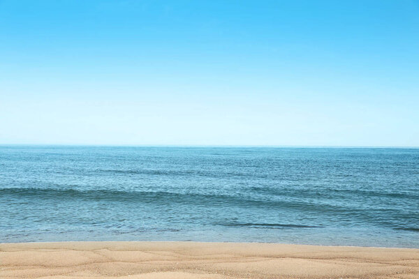 Picturesque view of sandy beach near sea