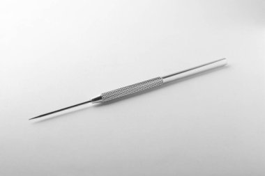 Stainless steel needle for clay modeling on white background