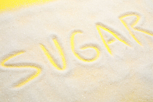 Composition with word SUGAR on yellow background