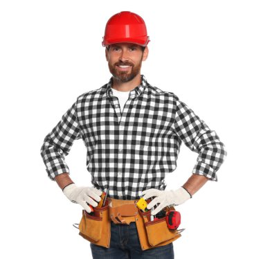 Professional builder in hard hat with tool belt isolated on white