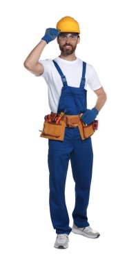 Professional builder in uniform with tool belt isolated on white