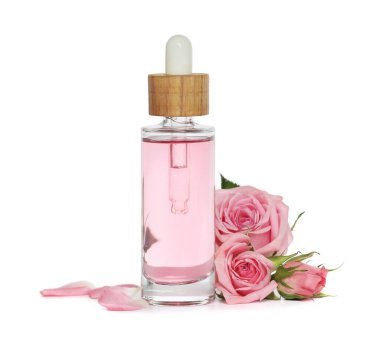 Bottle of essential rose oil and flowers on white background
