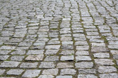 Old stone pathway with grass as background