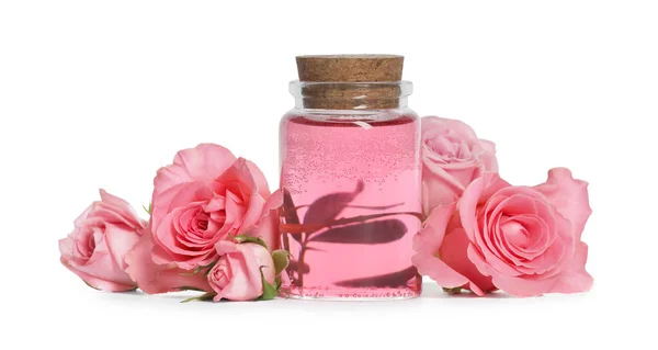 Bottle Essential Rose Oil Flowers White Background — Zdjęcie stockowe