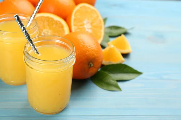 Delicious Orange Juice Fresh Fruits Light Blue Wooden Table Space — Stock Fotó
