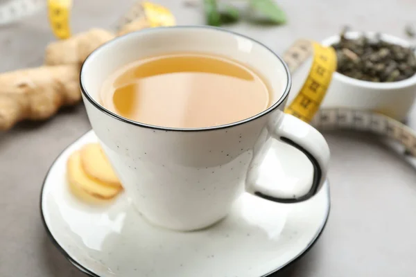 Cup Herbal Diet Tea Ginger Measuring Tape Light Table Closeup — Stok fotoğraf